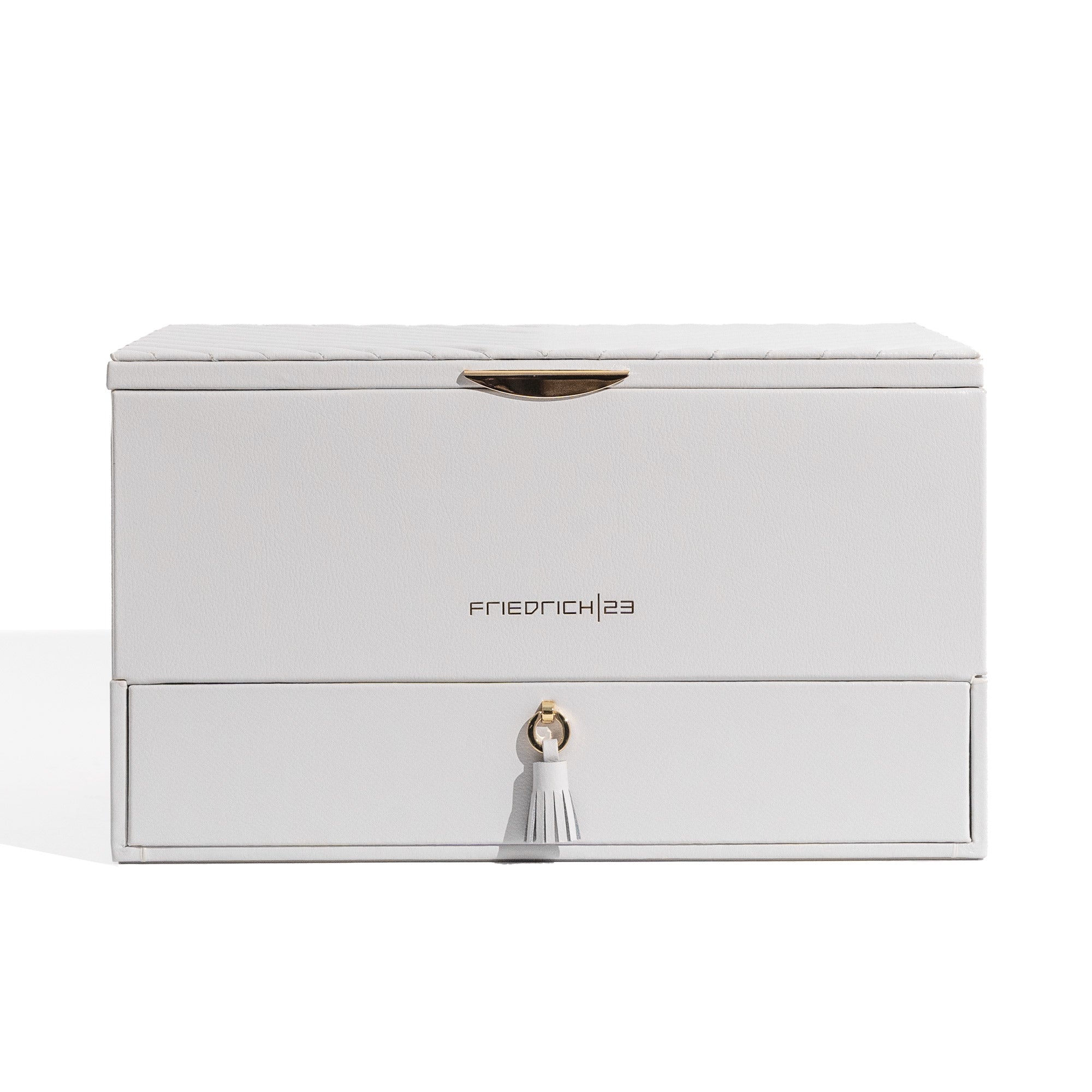 Hellgrauer Schmuckkoffer aus Leder mit Ziernähten und Beschlägen in Goldoptik, Lade mit Zierquaste sowie Friedrich23 Logo in Goldprägung